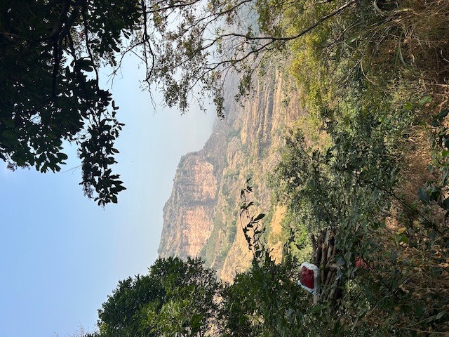 Travelers exploring a scenic path in Guinea